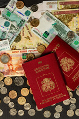inscription passport russian money coins and paper rubles lying on the table