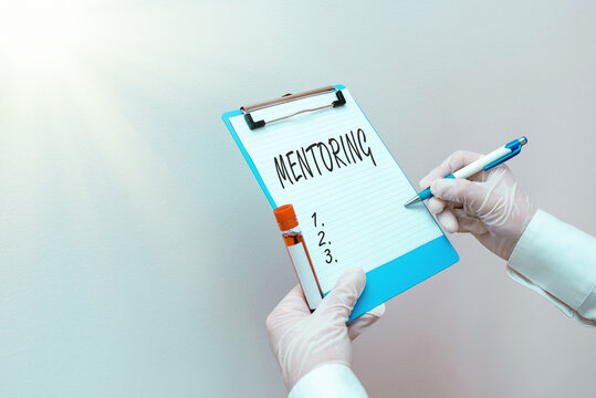 Writing Note Showing Mentoring. Business Concept For An Act Or Method Of Supporting And Giving Advice To A Younger Laboratory Blood Test Sample For Medical Diagnostic Analysis