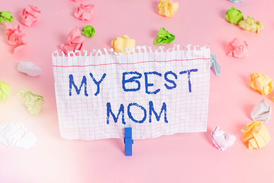 Conceptual hand writing showing My Best Mom. Concept meaning Appreciation for your mother s is love feelings compliment Colored crumpled papers empty reminder pink floor clothespin