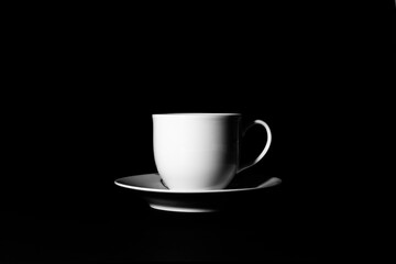 A cup on the black background with key light