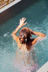 Summer. Swimming in the pool of a little girl. Holidays.