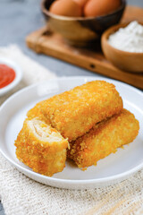 Delicious Risoles or Risol Mayo is a typical Indonesian traditional street food made from flour skin, meat and vegetables stuffing inside with mayonnaise and chili sauce.