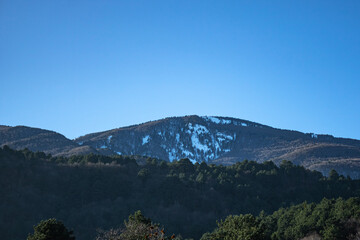 Landscape of a mountain, which is partly covered with snow