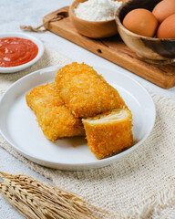 Delicious Risoles or Risol Mayo is a typical Indonesian traditional street food made from flour skin, meat and vegetables stuffing inside with mayonnaise and chili sauce.