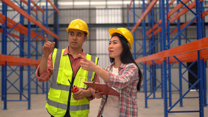 warehouse workers checking the shipment while working