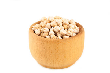 Uncooked dried chickpeas in wooden bowl isolated on white background. Vegan food concept