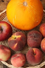 Nectarines and yellow melon on the table 