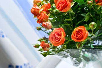 A bouquet of small orange flowers on a light background