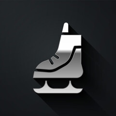 Silver Skates icon isolated on black background. Ice skate shoes icon. Sport boots with blades. Long shadow style. Vector Illustration.