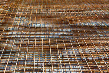Rusty reinforcement steel mesh mats prepared for a base plate on a construction site