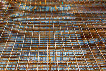 Rusty reinforcement steel mesh mats prepared for a base plate on a construction site