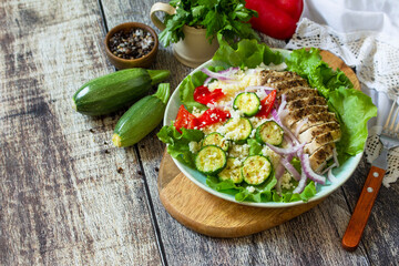 Eastern cuisine. Summer lunch, healthy salad with couscous, grilled vegetables and lettuce. Copy...