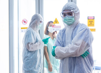 Fototapeta premium COVID-19, Corona Virus outbreak quarantine epidemic spread and social distancing concept. Asian doctors wear PPE monitor patient health and encourage depressed CORONA or COVID-19 patient infection