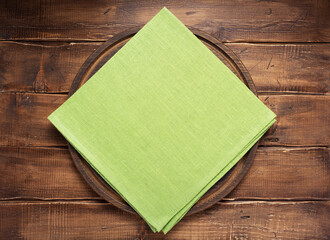 table cloth napkin and pizza cutting board on wooden background
