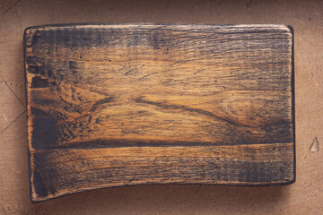 aged wooden nameplate at wood board background