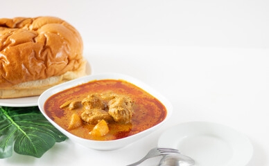 Singapore Curry Chicken Flatlay With Bread. Curry Chicken on White Background. Chinese Curry Served With Bread.
