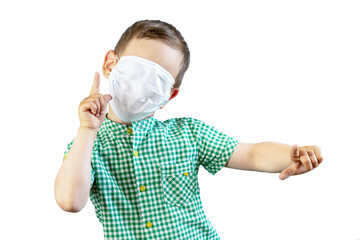 A boy in a green shirt and a medical mask on his face shows the direction with his index fingers....