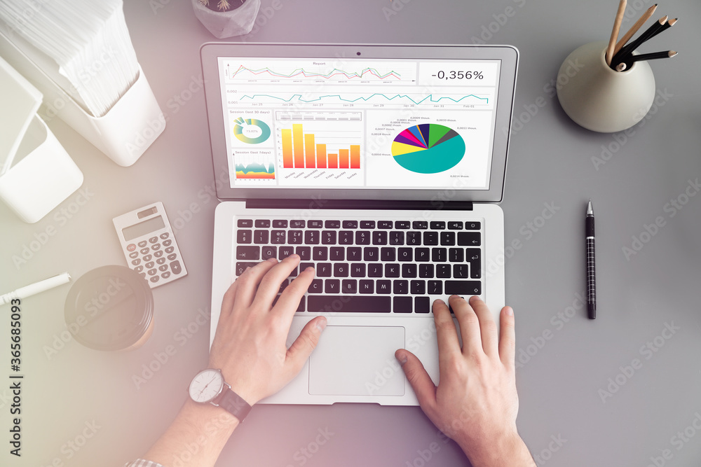 Poster man using laptop at table, top view. business analytics