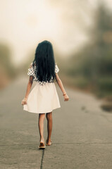 girl walking on the road