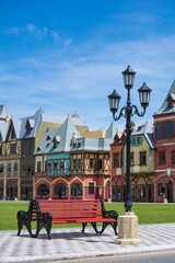 Fototapeta premium Street lamppost against the blue sky background of decorative old buildings on the island of Phu Quoc, Vietnam