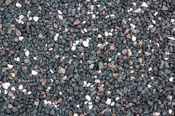 crushed stone of different colors, dark gray, white.