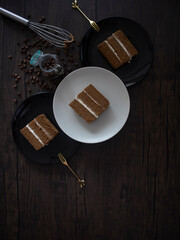 Coffee Chiffon Cake on Dark Background. Coffee Layer Cake on Black Table. Coffee Cake Flatlay....