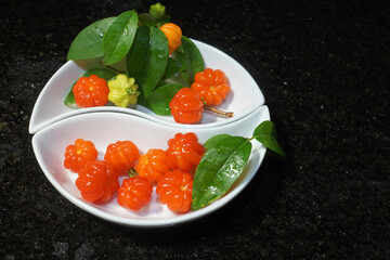 Fototapeta na wymiar red wild fruit on white plate