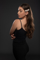 Fototapeta premium Beautiful girl posing on grey background. Isolated Beauty session