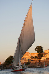 Sailing on the Nile with traditional river sailing ships photographed in daylight