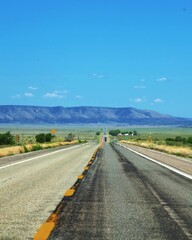 road in the desert with mountains