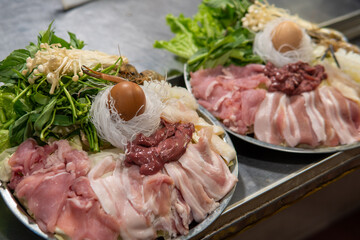 Plate of meat for sale at night Market in Northern Thailand