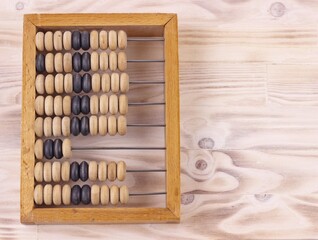 Education, training, account, back to school concept. Old wooden abacus on pure wooden pine...