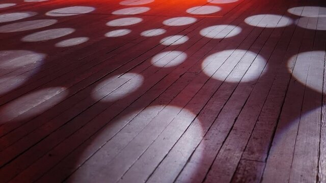 Concert wooden stage with white rays on the floor. Concert lighting on an empty stage, circles of light on the floor.