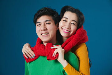 young couple sharing scarf