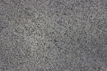 Gray rough marble texture interspersed with black background