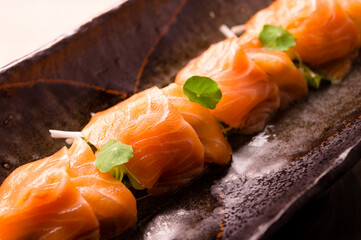 fresh pink raw salmon sashimi wrap with vegetables