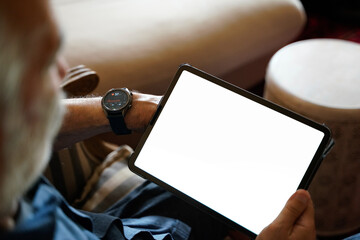 old man white hair with smart watch using pro tablet