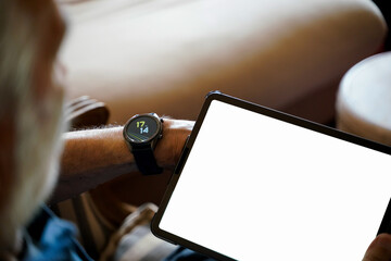 old man white hair with smart watch using pro tablet