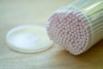 Pink cotton swabs in close up.