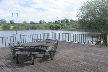 Old lakeside furniture and decking with lake view