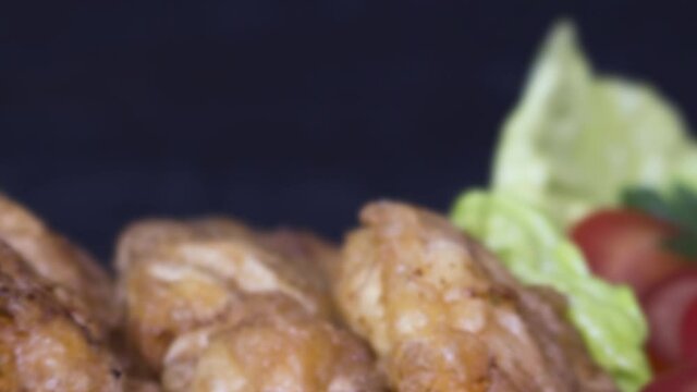 Breaded chicken meat searved with lemon and fresh salad on rustic wooden board phoro slide show animation