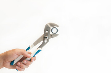 Wrench in hand. On a white background. Isolated. Repair services. Plumbing