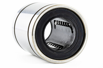 Macro shot of the inside of a linear bearing, isolated on a white background, selective focus.