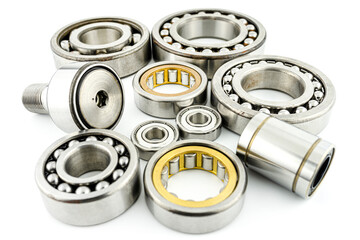 Background made of several ball bearings, isolated on a white background, selective focus.