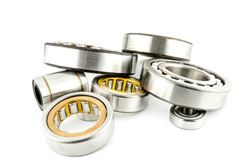 Background made of several ball bearings, isolated on a white background, selective focus.