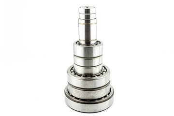 Background made of ball bearings arranged in the shape of a tower, isolated on a white background.