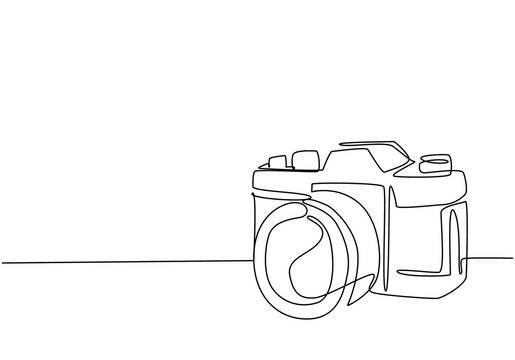 One single line drawing of old retro analog slr camera with telephoto lens. Vintage classic photography equipment concept continuous line draw graphic design vector illustration