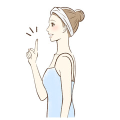 笑顔で指をさす女性の横顔