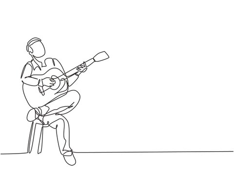 One single line drawing of young happy male guitarist playing acoustic guitar while sitting on chair. Modern musician artist performance concept continuous line draw design vector illustration graphic