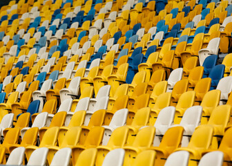 Free seats on stadium. Yellow, blue, white
